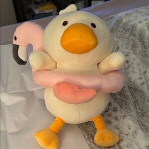 Duck Carrying Flamingo Friend